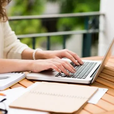 Designer working beside a garden